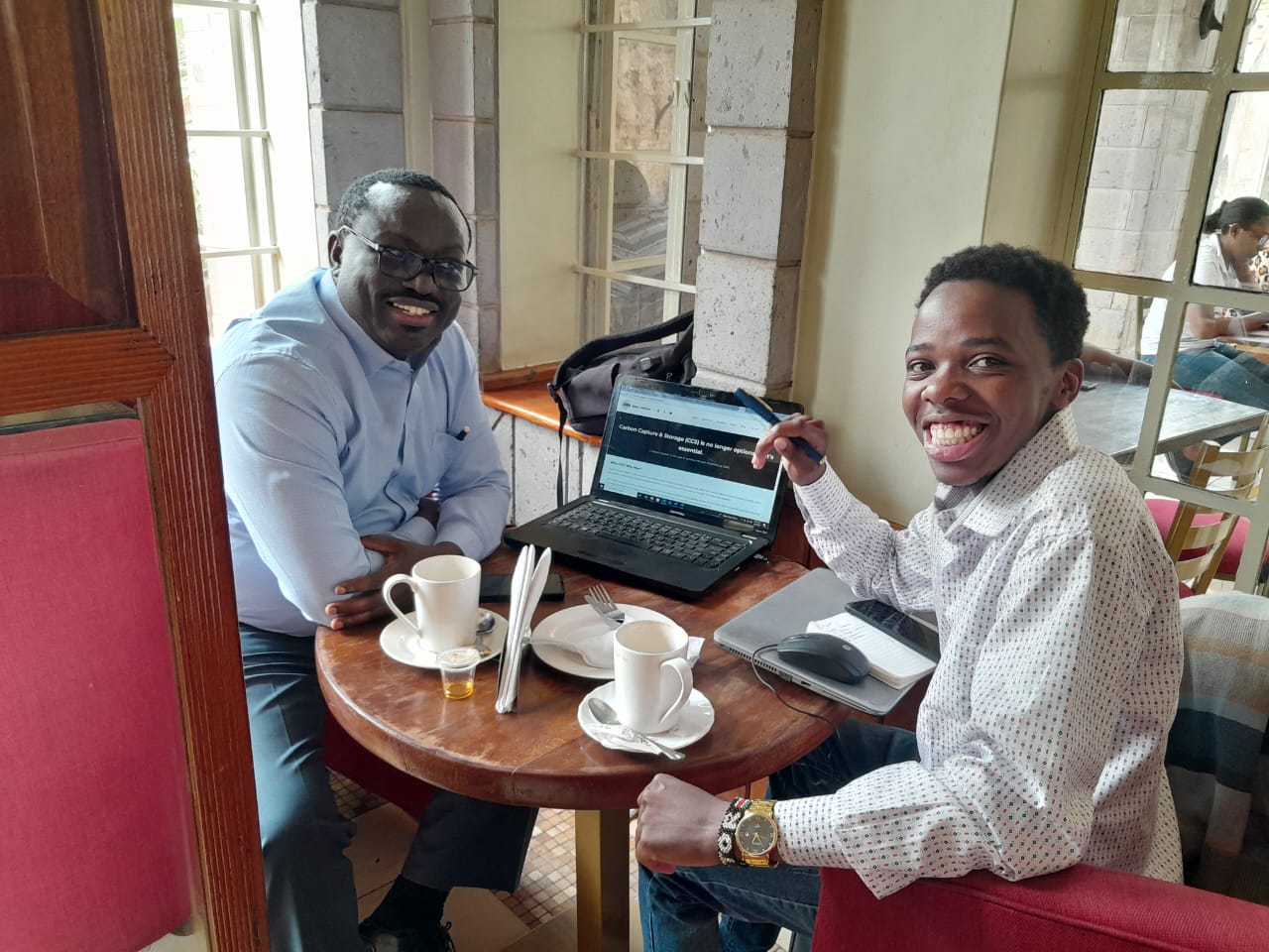 Digital agency workspace showing web design mockups and analytics dashboards